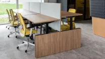Office desks with desk separators installed