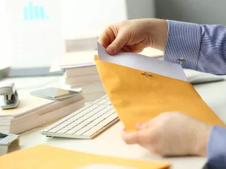 Man opening a letter - Hybrid mail