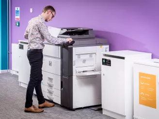Man printing document in office