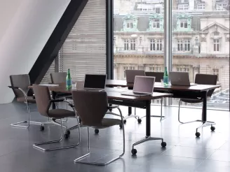 Glass meeting room with boardroom table and chairs