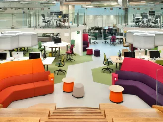 Birds eye view of office area with different styles of seating area and breakout spaces
