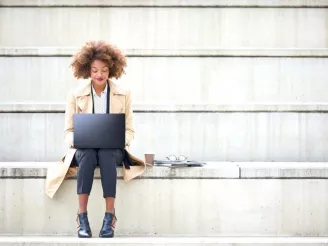 A woman working on a laptop