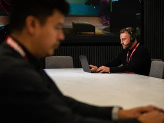 two people working at desk