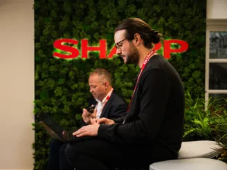 two people working at sharp office