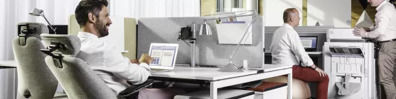 A man using a laptop in an office