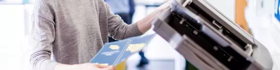 Woman using colour photocopier