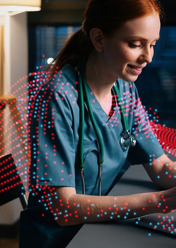 Doctor typing on a laptop