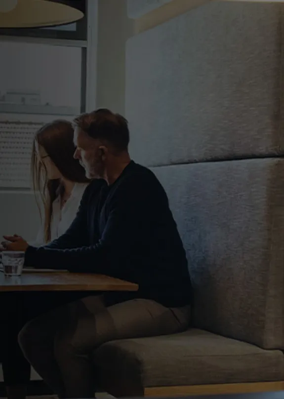 three people sat at breakout furniture