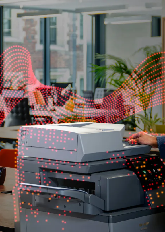 People talking in a modern office by a Sharp A4 MFP