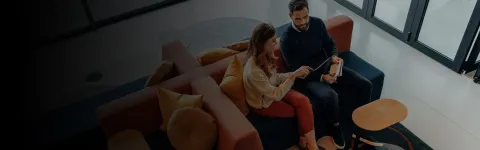 two people looking at tablet