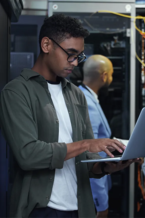 IT technician in front of server rack